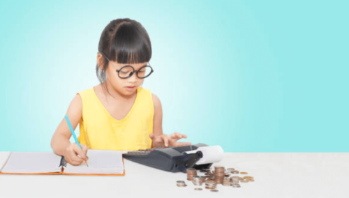 child working on a calculator what are the changes in taxes this year 